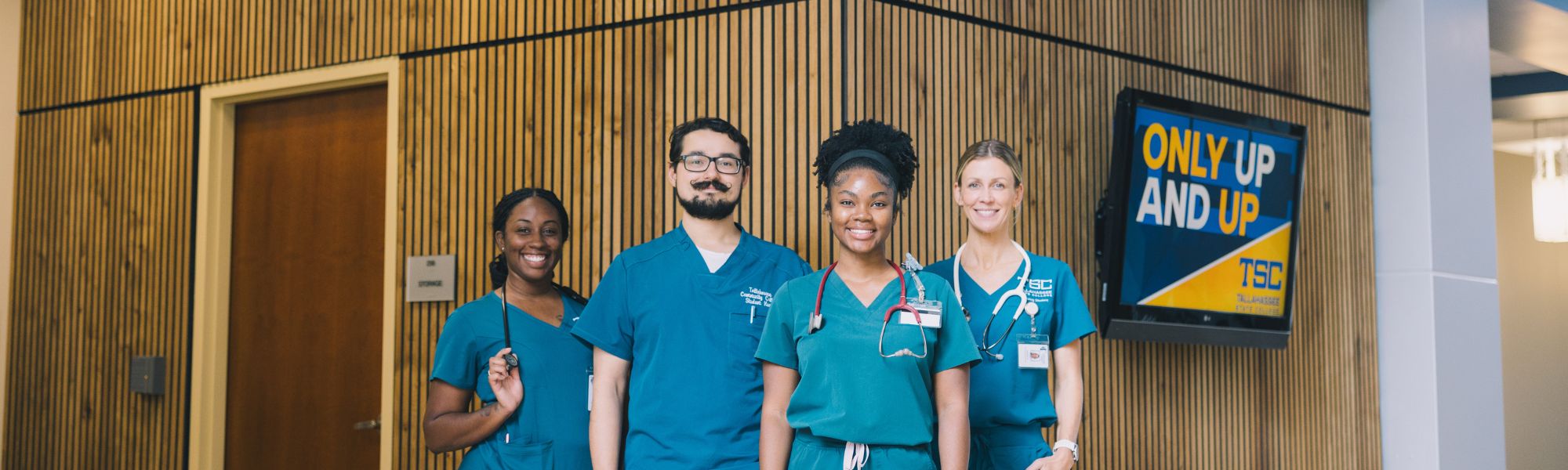 Ghazvini students posing in their blue scrubs.