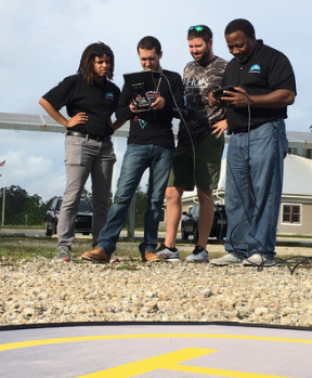 Students and Instructor monitoring a flyer drone